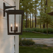 Belmont 3 Light 12" Outdoor Sconce in Twilight Bronze in a room setting