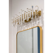 Bolton 3 Light 25.25" Bathroom Vanity in Aged Brass in a room setting