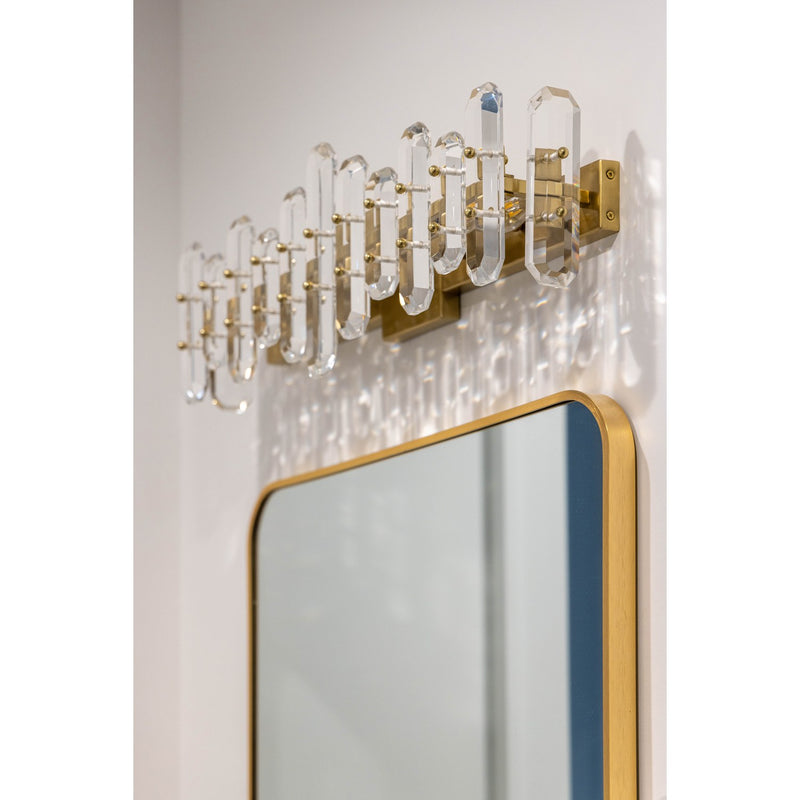 Bolton 3 Light 25.25" Bathroom Vanity in Aged Brass in a room setting