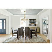 Bolton 8 Light 24.75" Chandelier in Aged Brass in a room setting