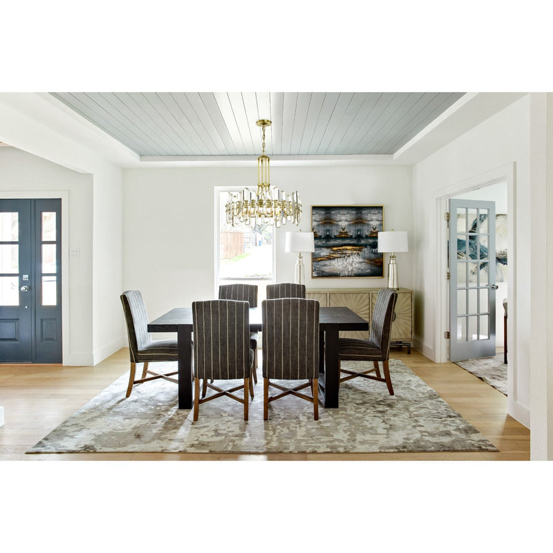 Bolton 8 Light 24.75" Chandelier in Aged Brass in a room setting