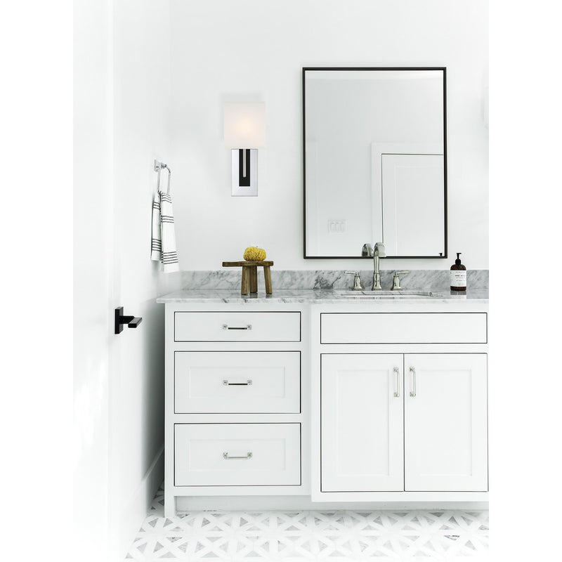 Brent 1 Light 6.5" Sconce in Polished Nickel + Black Forged in a room setting