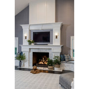 Brent 1 Light 6.5" Sconce in Vibrant Gold + Black Forged in a room setting
