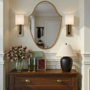 Brent 1 Light 6.5" Sconce in Vibrant Gold + Black Forged in a room setting