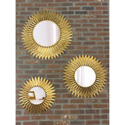 Broche 20" Mirror in Antique Gold in a room setting