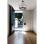Bryant 6 Light 24" Chandelier in Black Forged in a room setting
