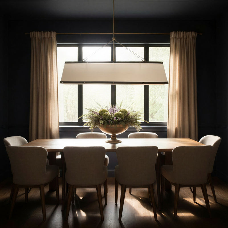 Callahan 6 Light 47.5" Linear Oval Pendant in Luxe Gold in a room setting
