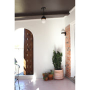 Capsule 3 Light 12.25" Outdoor Pendant in Matte Black + Textured Gold in a room setting