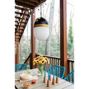 Capsule 1 Light 8" Outdoor Pendant in Matte Black + Textured Gold in a room setting