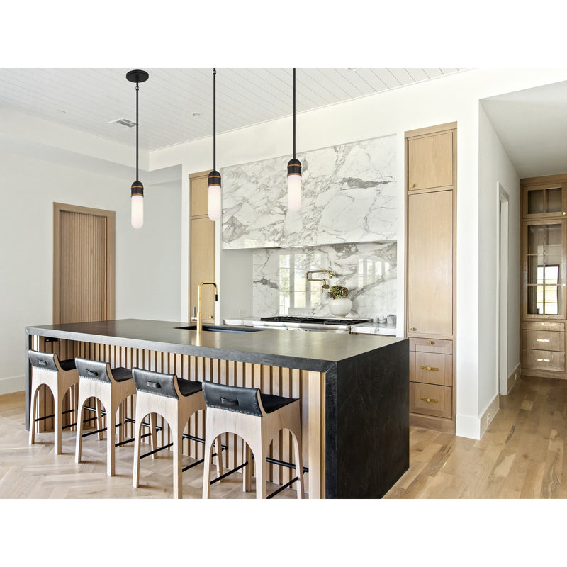 Capsule 1 Light 3.25" LED Pendant in Matte Black + Textured Gold in a room setting