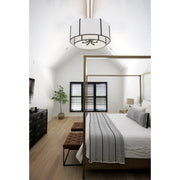 Carlyn 6 Light 28" Pendant in Black in a room setting