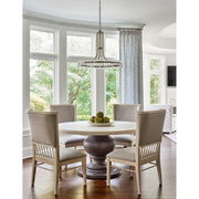 Clover 12 Light 28.75" Chandelier in Aged Brass in a room setting