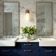Calvin 1 Light 4.75" Integrated LED Sconce in Vibrant Gold in a room setting
