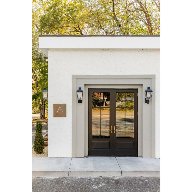 Dumont 3 Light 9.25" Outdoor Sconce in Graphite in a room setting