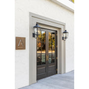 Dumont 3 Light 9.25" Outdoor Sconce in Graphite in a room setting