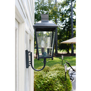 Dumont 3 Light 9.25" Outdoor Sconce in Graphite in a room setting