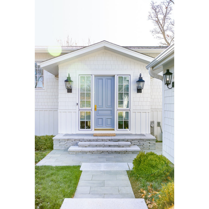 Dumont 3 Light 12" Outdoor Sconce in Graphite in a room setting