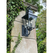 Dumont 4 Light 14.5" Outdoor Sconce in Graphite in a room setting