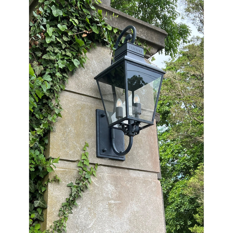 Dumont 4 Light 14.5" Outdoor Sconce in Graphite in a room setting
