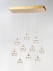 Swank 10-Light LED Linear Pendant in Natural Aged Brass