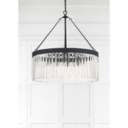 Emory 8 Light 24" Chandelier in Black Forged in a room setting