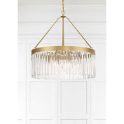Emory 8 Light 24" Chandelier in Modern Gold in a room setting