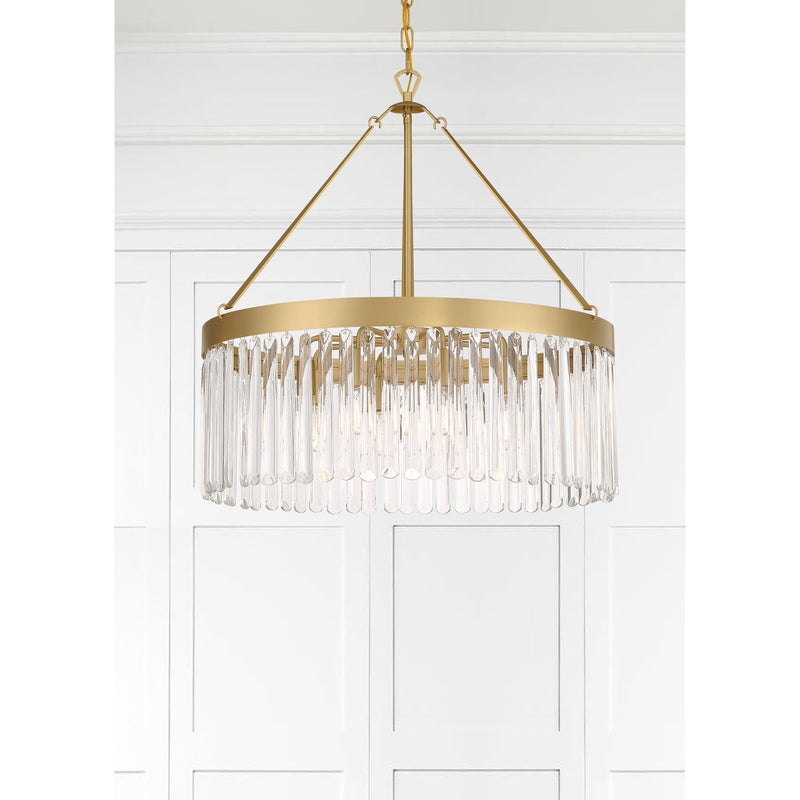 Emory 8 Light 24" Chandelier in Modern Gold in a room setting