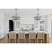 Emory 9 Light 32" Chandelier in Black Forged in a room setting