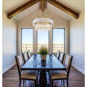 Emory 9 Light 32" Chandelier in Modern Gold in a room setting