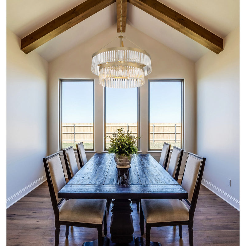 Emory 9 Light 32" Chandelier in Modern Gold in a room setting
