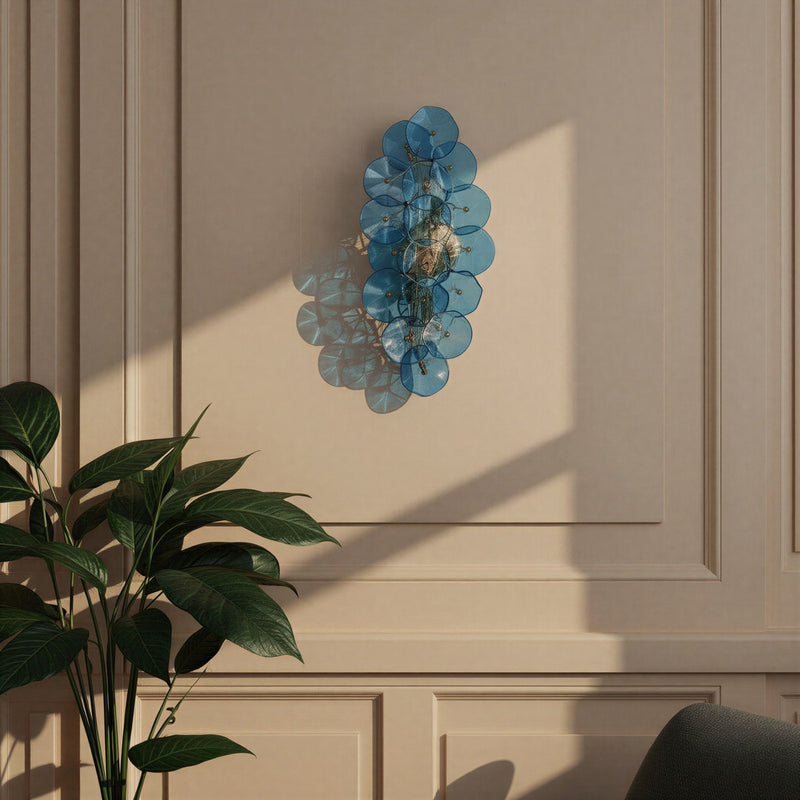 Esme 4 Light 23" Sconce in Aged Brass in a room setting