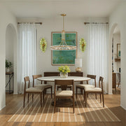 Esme 4 Light 23" Sconce in Aged Brass in a room setting