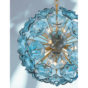 Esme 9 Light 22.5" Chandelier in Aged Brass in a room setting