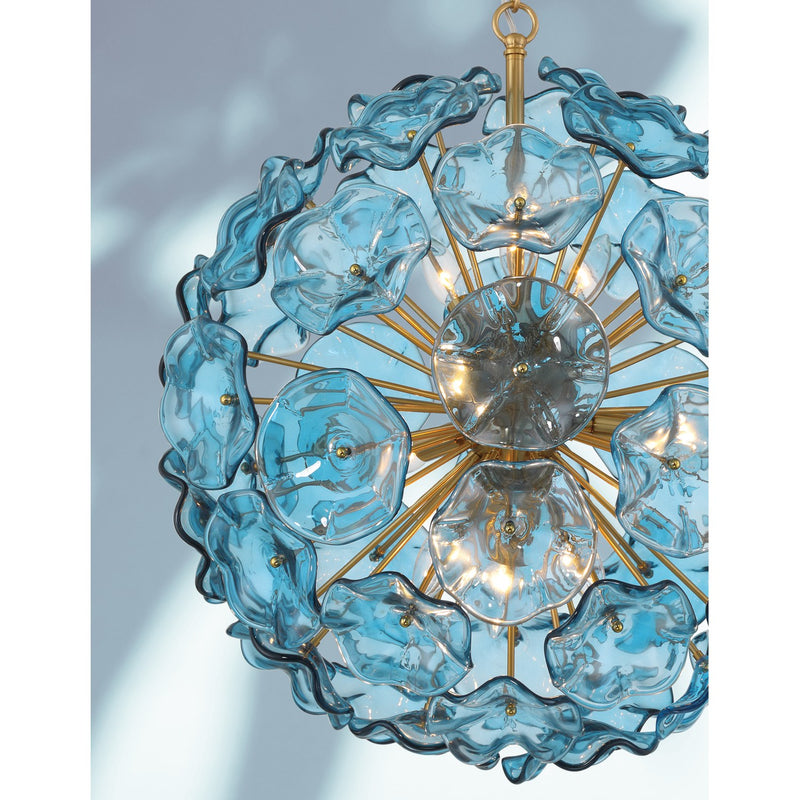 Esme 9 Light 22.5" Chandelier in Aged Brass in a room setting