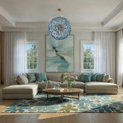 Esme 12 Light 28" Chandelier in Aged Brass in a room setting