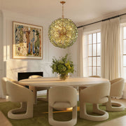 Esme 12 Light 28" Chandelier in Aged Brass in a room setting