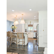 Fulton 3 Light 20" Pendant in Antique Gold in a room setting