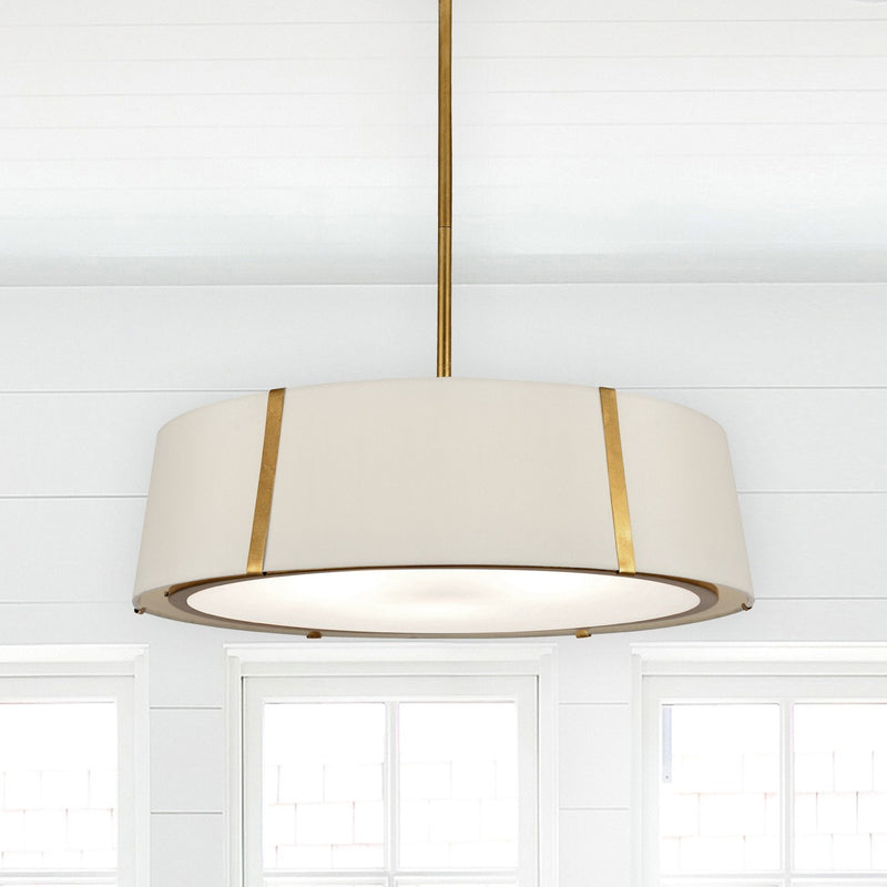 Fulton 6 Light 24" Pendant in Antique Gold in a room setting