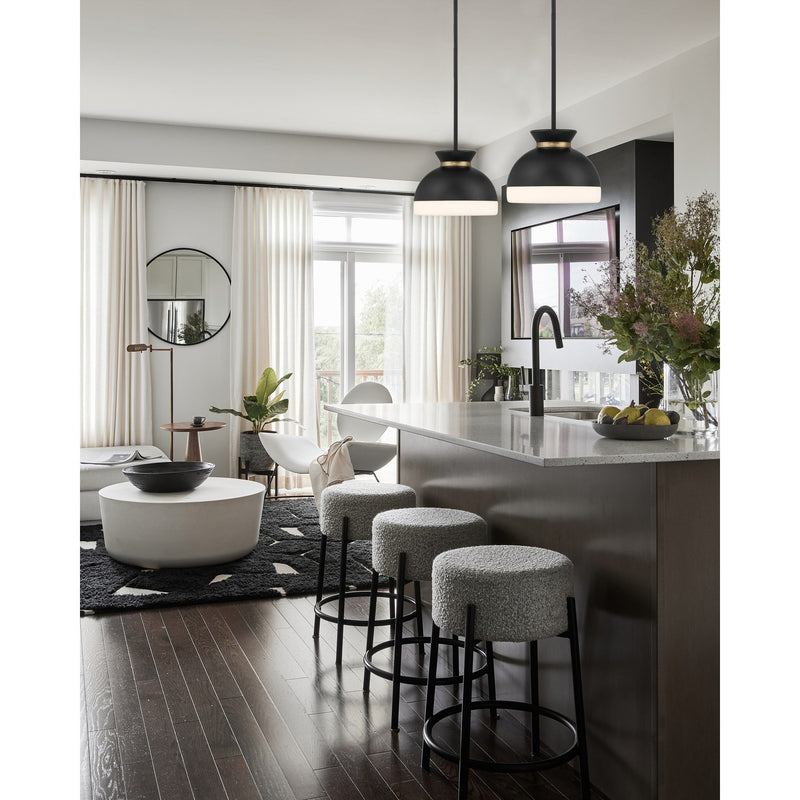 Gidget 1 Light 10.25" Pendant in Matte Black + Vibrant Gold in a room setting