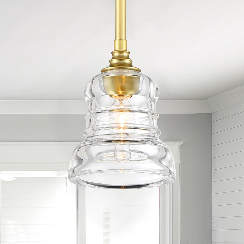 Gregory 1 Light 5" Pendant in Aged Brass in a room setting
