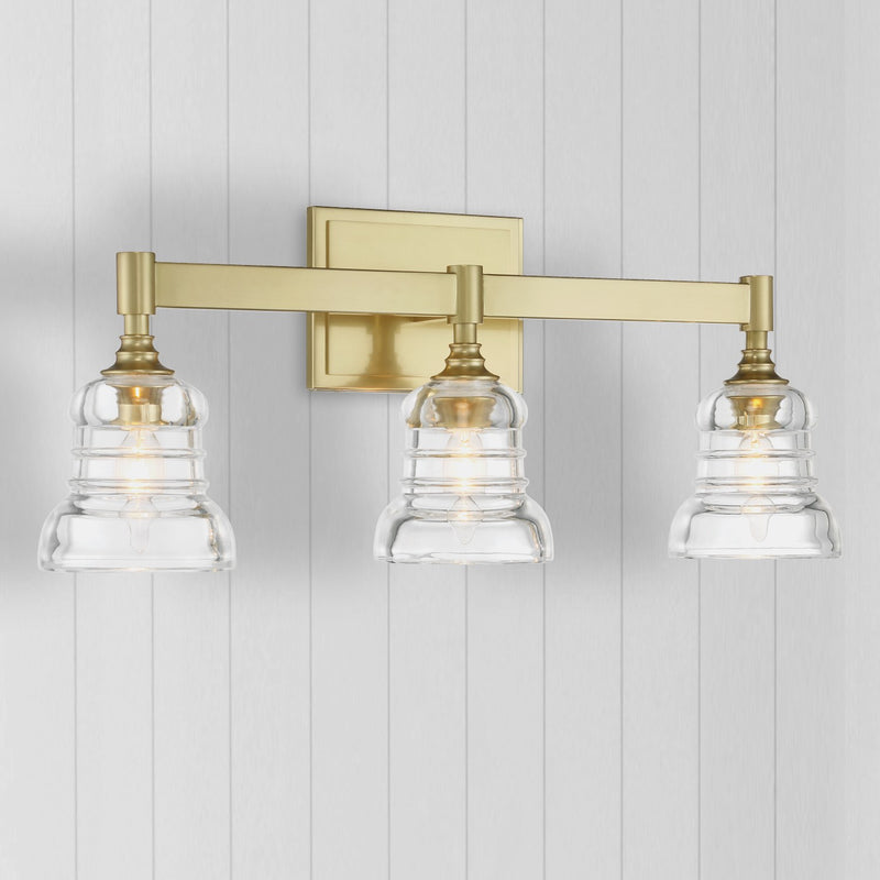 Gregory 3 Light 23.75" Bathroom Vanity in Aged Brass in a room setting