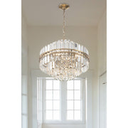 Hayes 12 Light 22" Pendant in Aged Brass in a room setting