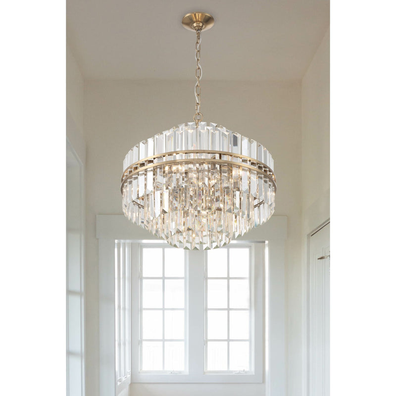 Hayes 12 Light 22" Pendant in Aged Brass in a room setting