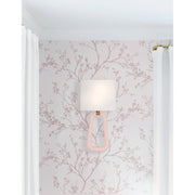 Jori 2 Light 10" Sconce in Aged Brass + Blush in a room setting