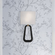 Jori 2 Light 10" Sconce in Aged Brass + Matte Black in a room setting