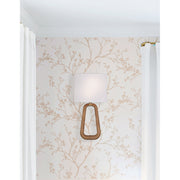 Jori 2 Light 10" Sconce in Aged Brass + Wood in a room setting