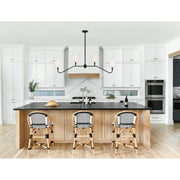 Keenan 4 Light 48" Linear Chandelier in Black Forged in a room setting