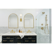 Lena 1 Light 6" Sconce in Vibrant Gold in a room setting