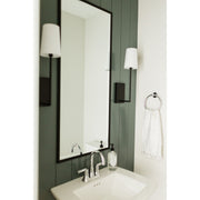 Lena 1 Light 4.5" Sconce in Black Forged in a room setting