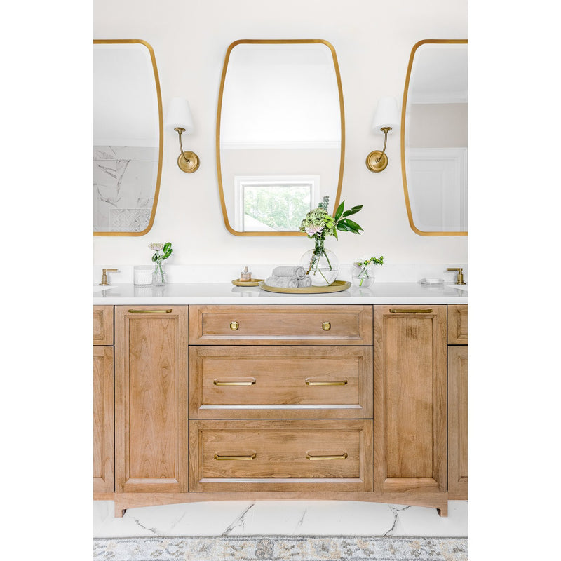 Lindee 24" Mirror in Antique Gold in a room setting